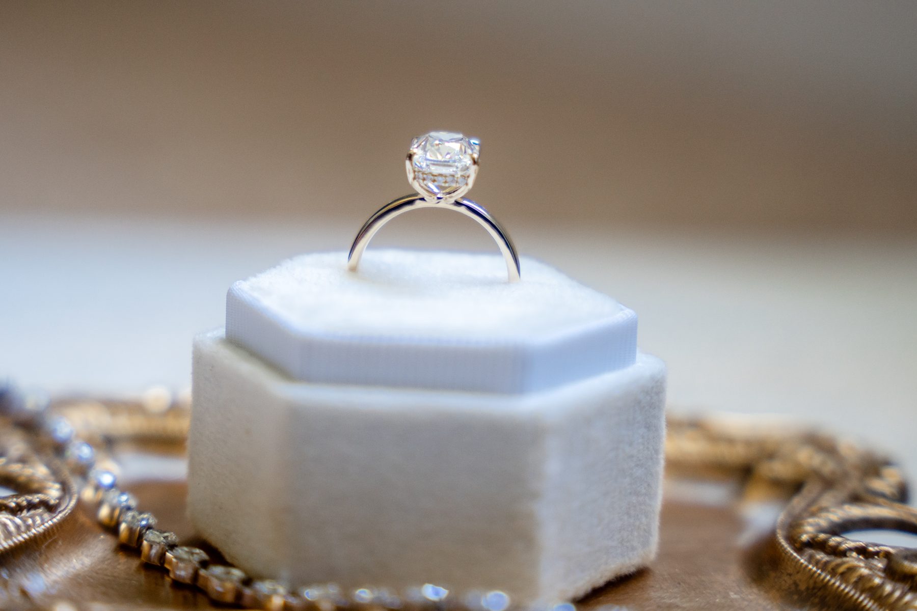 Diamond ring on a white jewelry display